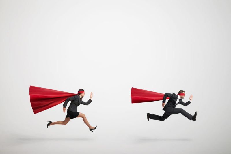 superman and superwoman fast running over light grey background